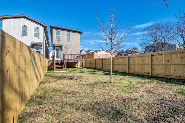 view of yard with a wooden deck