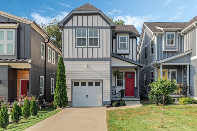 multi unit property featuring a garage and a front lawn