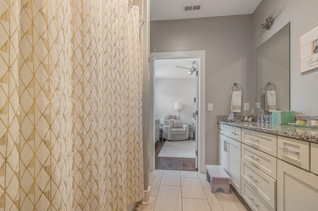 bathroom featuring tile patterned floors and vanity