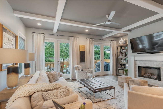 living room featuring french doors, coffered ceiling, ceiling fan, beam ceiling, and hardwood / wood-style floors