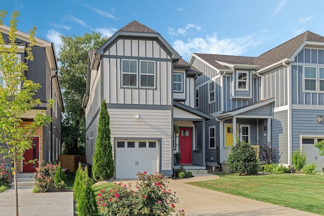 view of front of home featuring a front lawn and a garage