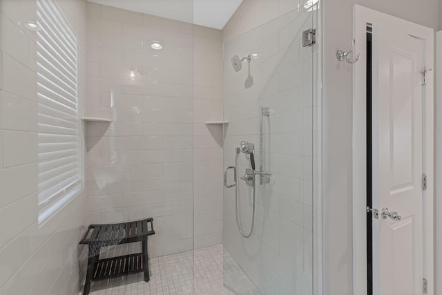 bathroom with lofted ceiling and an enclosed shower