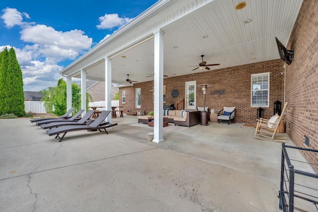 view of patio with ceiling fan and an outdoor hangout area