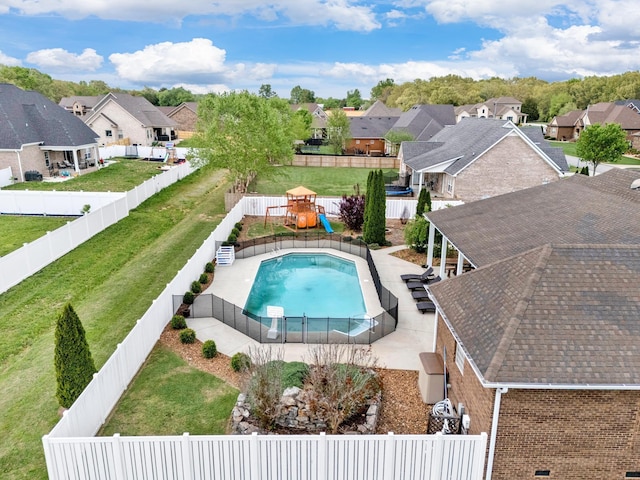 view of swimming pool featuring a playground