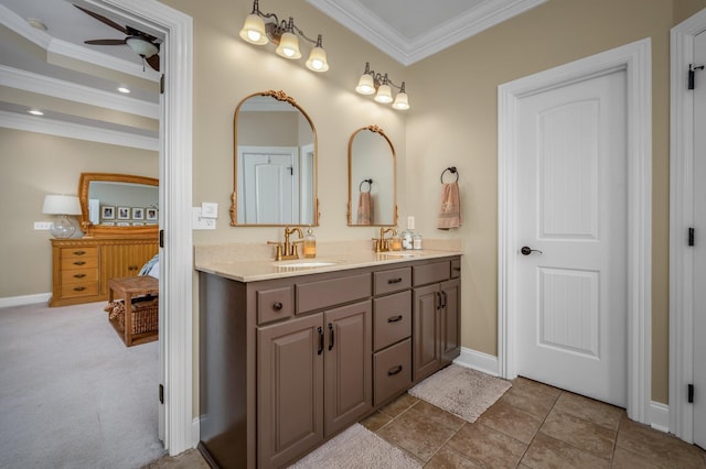 bathroom featuring vanity, ceiling fan, and crown molding