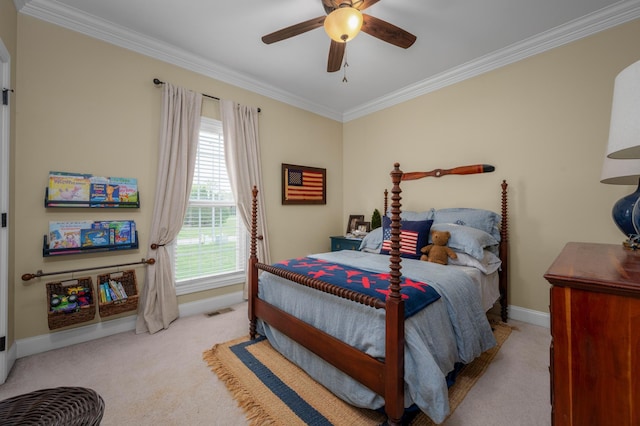 carpeted bedroom featuring ceiling fan and ornamental molding