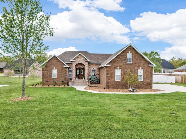 view of front of property featuring french doors and a front lawn