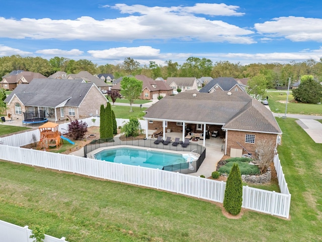 view of pool featuring an outdoor living space, a playground, and a lawn