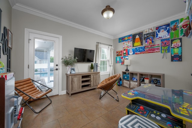 recreation room featuring light tile patterned floors and ornamental molding