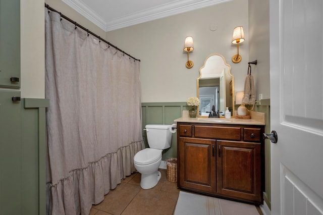 bathroom featuring toilet, tile patterned flooring, vanity, and ornamental molding