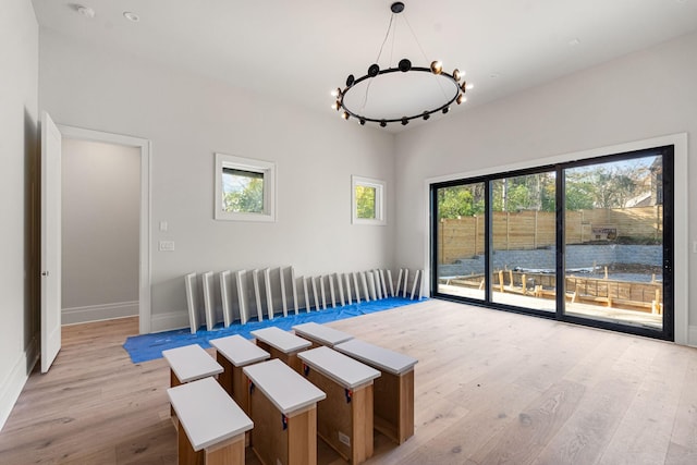 unfurnished dining area with light hardwood / wood-style flooring and a healthy amount of sunlight