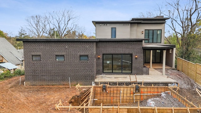 back of property with a patio