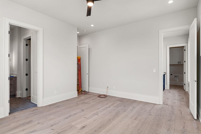 unfurnished bedroom featuring light wood-type flooring and ceiling fan