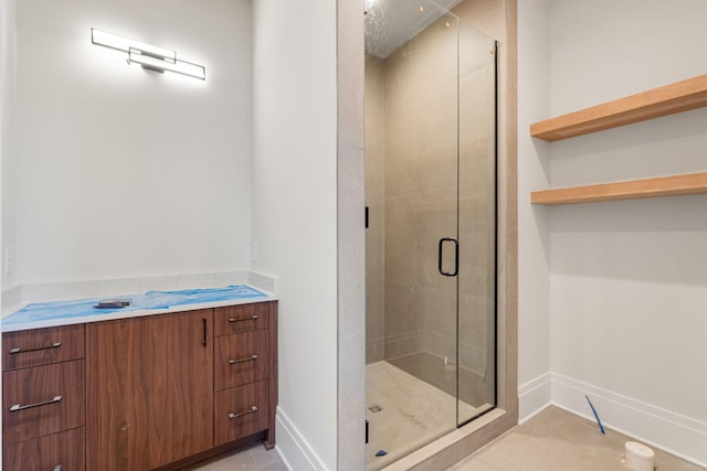 bathroom with tile patterned floors and walk in shower