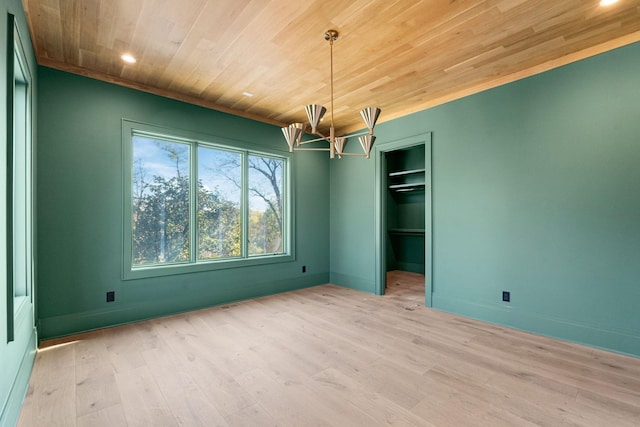 unfurnished bedroom with wood ceiling, a closet, and light hardwood / wood-style floors