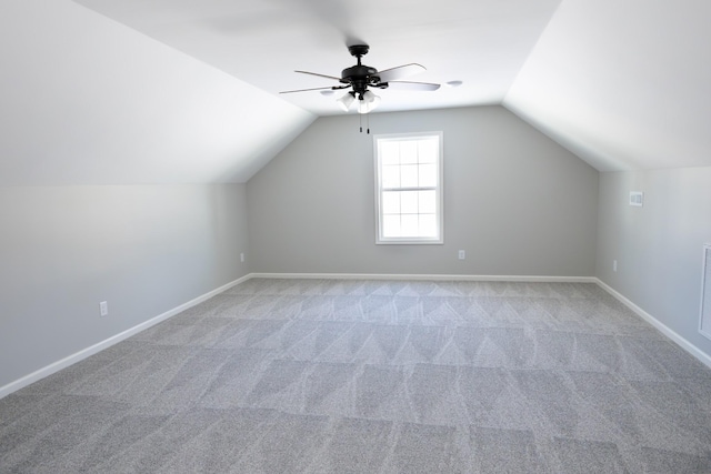 bonus room with carpet floors, ceiling fan, and lofted ceiling