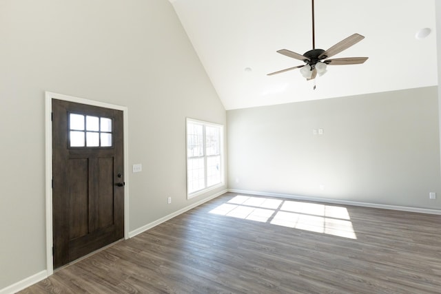 entrance foyer featuring dark hardwood / wood-style flooring, high vaulted ceiling, and ceiling fan