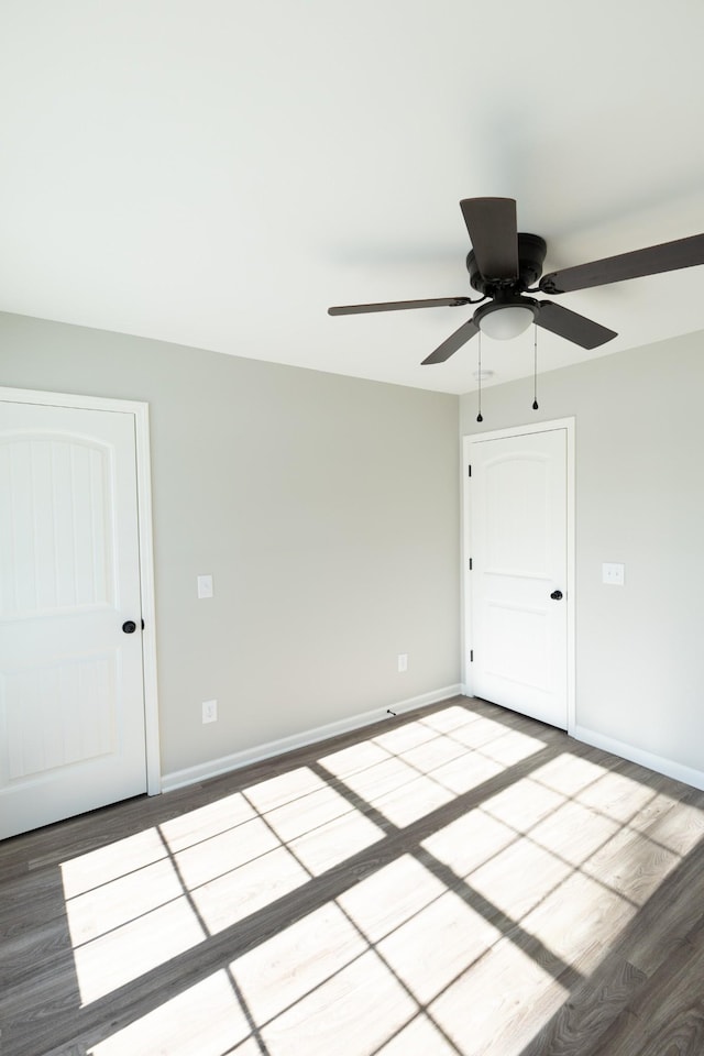 unfurnished room featuring ceiling fan and wood-type flooring