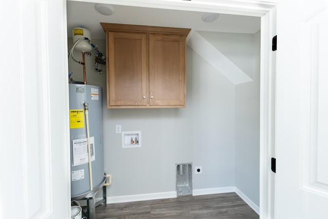 washroom with electric dryer hookup, cabinets, hookup for a washing machine, water heater, and dark hardwood / wood-style flooring