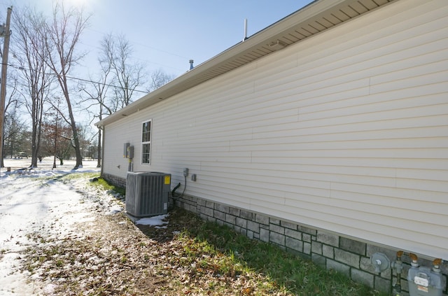 view of property exterior featuring central AC