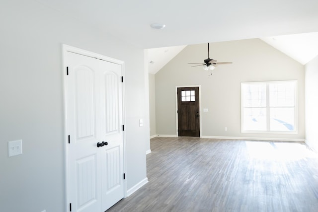 entryway with ceiling fan, hardwood / wood-style floors, and lofted ceiling