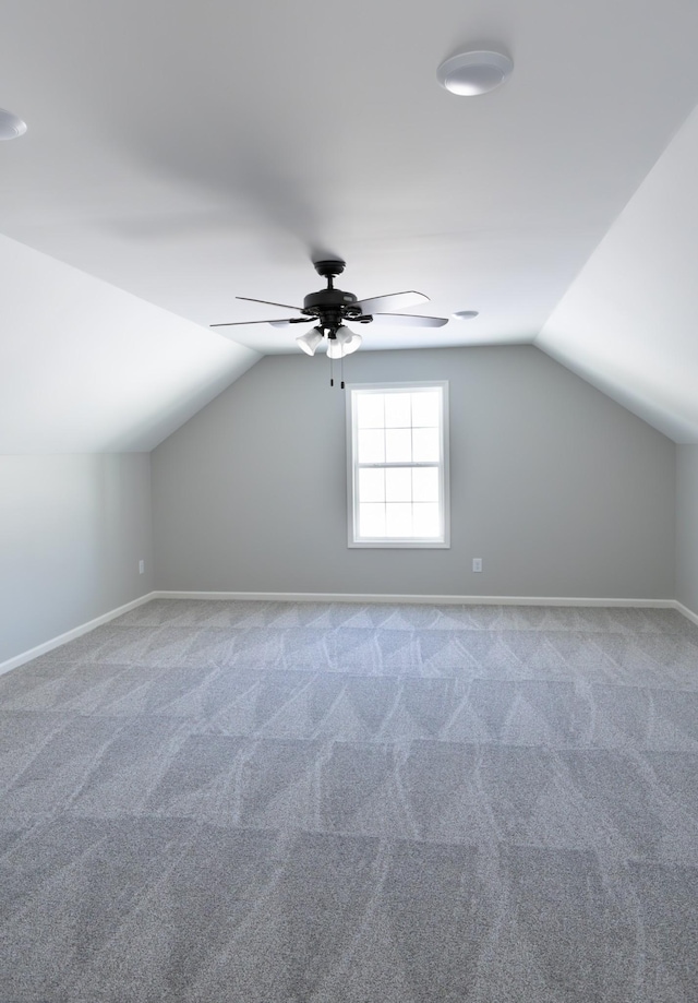 bonus room with carpet flooring, ceiling fan, and lofted ceiling