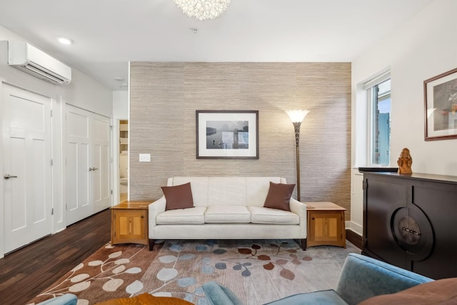 living room featuring an AC wall unit and dark wood-type flooring