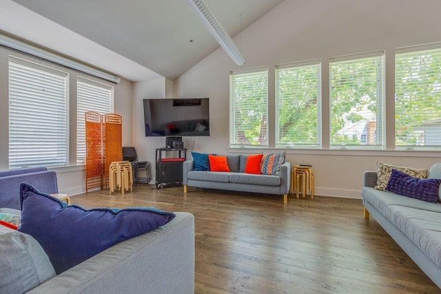 living room featuring vaulted ceiling with beams and dark wood-type flooring