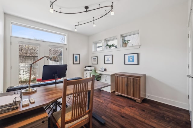 office area with dark hardwood / wood-style flooring, rail lighting, and french doors