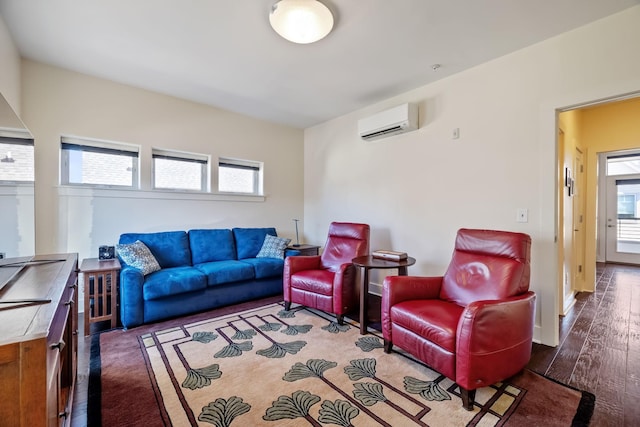 living room featuring a wall mounted air conditioner and dark hardwood / wood-style floors