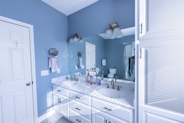 bathroom featuring toilet and vanity