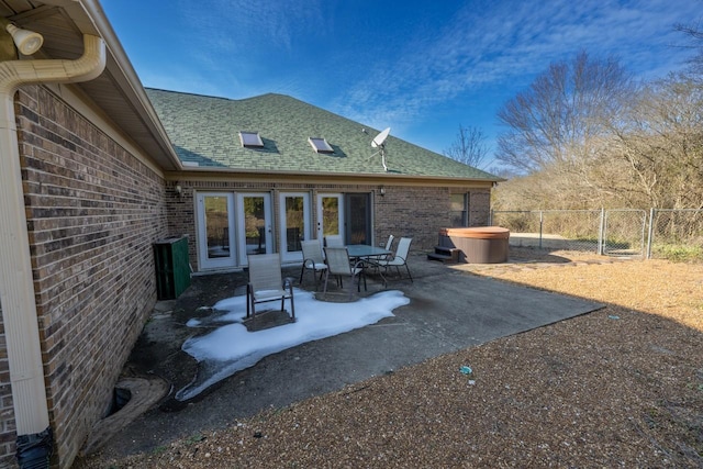 view of patio / terrace with a hot tub