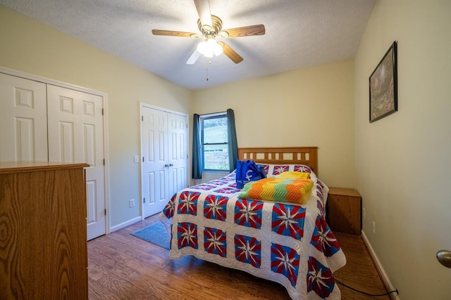 bedroom featuring ceiling fan, a textured ceiling, and hardwood / wood-style floors