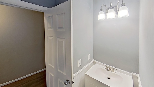 bathroom with vanity and hardwood / wood-style flooring