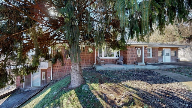 view of front facade with a patio area