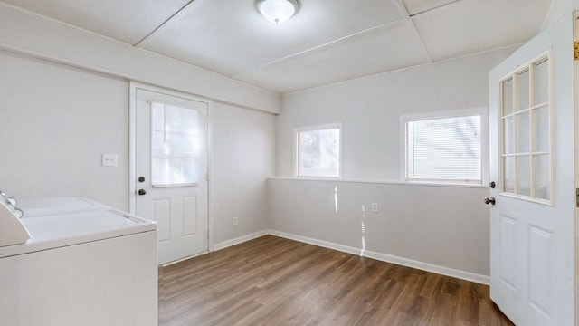 laundry area featuring dark hardwood / wood-style floors and washing machine and dryer