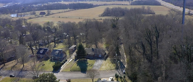 birds eye view of property with a rural view