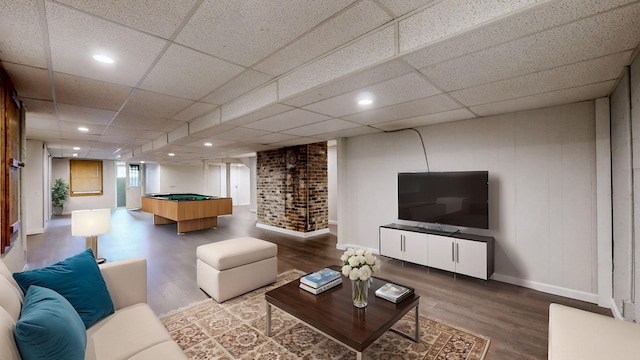 living room with hardwood / wood-style flooring and pool table