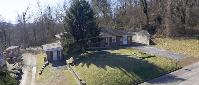 ranch-style house with a front lawn