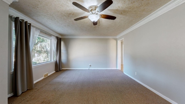 carpeted spare room featuring ceiling fan, ornamental molding, and a textured ceiling