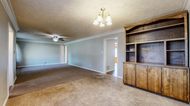 unfurnished living room featuring ceiling fan with notable chandelier, a textured ceiling, ornamental molding, and light carpet