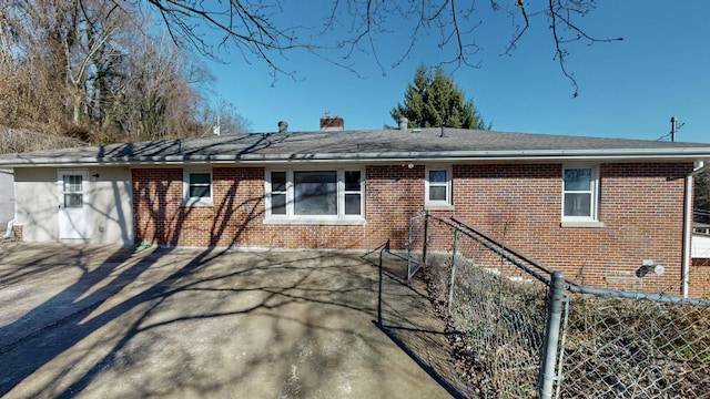 rear view of property featuring a patio