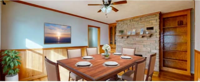 dining room featuring crown molding and ceiling fan