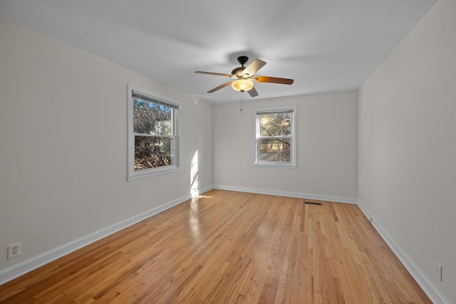 spare room with ceiling fan and light hardwood / wood-style flooring