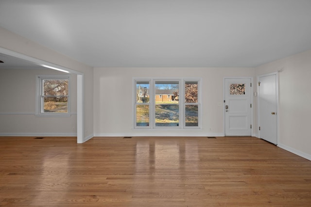 interior space with a healthy amount of sunlight and light hardwood / wood-style floors