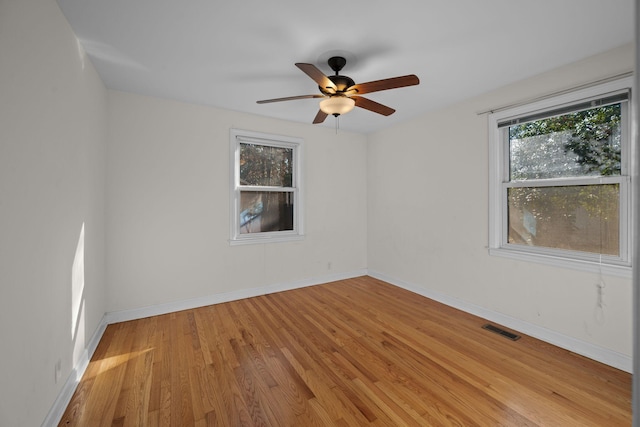 spare room with ceiling fan and light hardwood / wood-style flooring