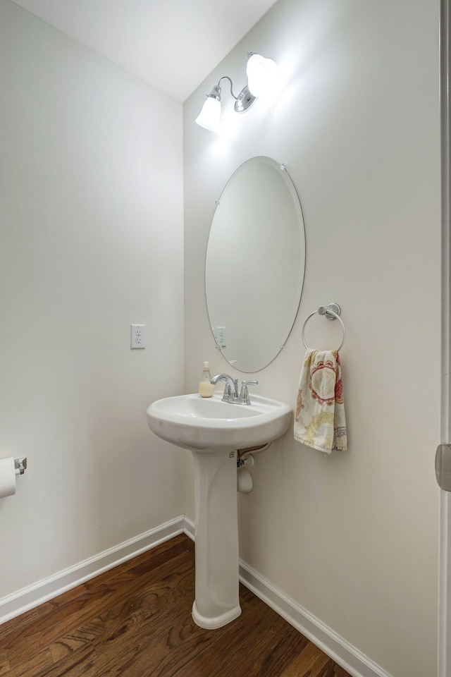 bathroom with hardwood / wood-style flooring