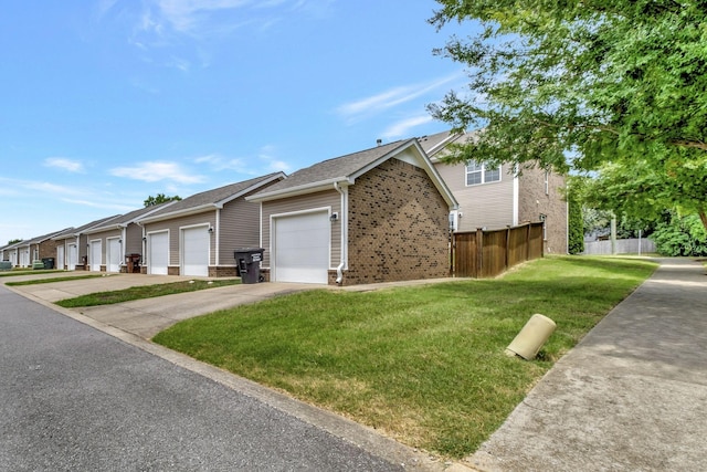 view of front of home featuring a garage and a front lawn