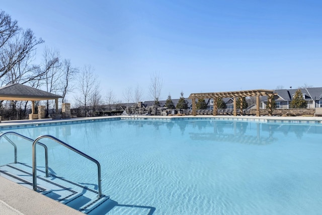 view of swimming pool with a pergola