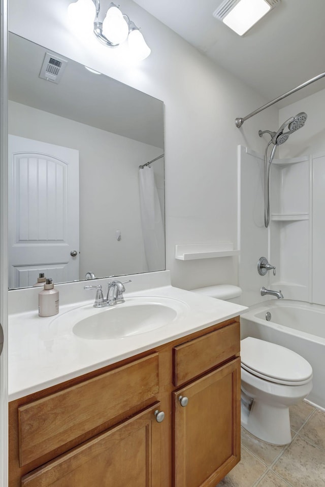 full bathroom featuring tile patterned floors, vanity, tub / shower combination, and toilet